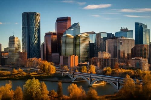 Canadian city skyline in autumn colours with a bridge over the river