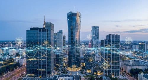 Warsaw towers at dusk under a glowing payment-network overlay